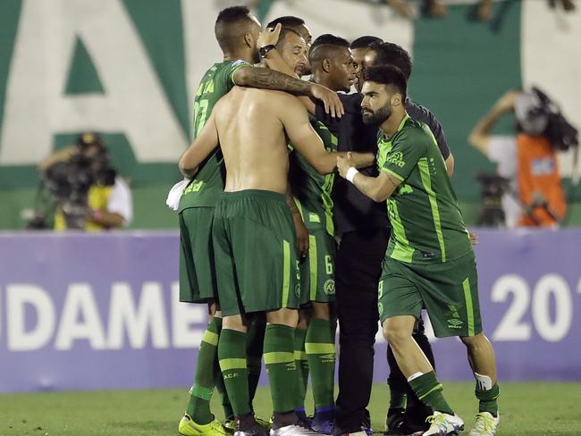 Players of Brazil's Chapecoense celebrate at the end of the Copa Sudamericana semi-final football match against Argentina's San Lorenzo in Chapeco, Brazil, on November 23. Picture: Andre Penner.