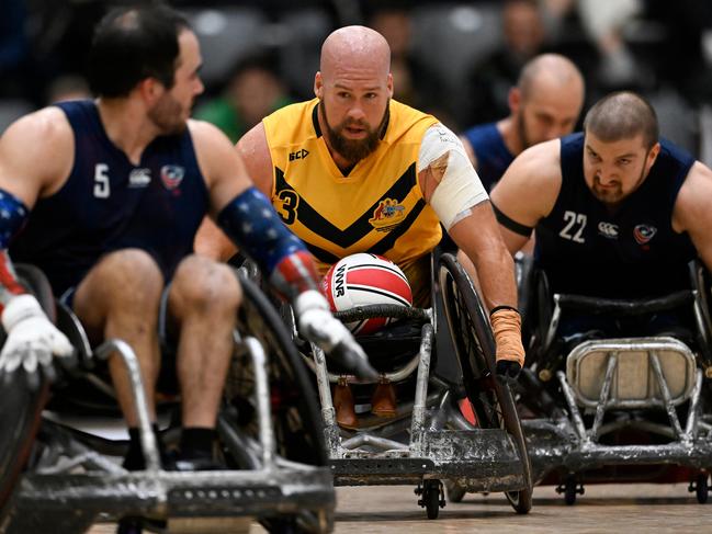 Ryley Batt helps win the wheelchair rugby.