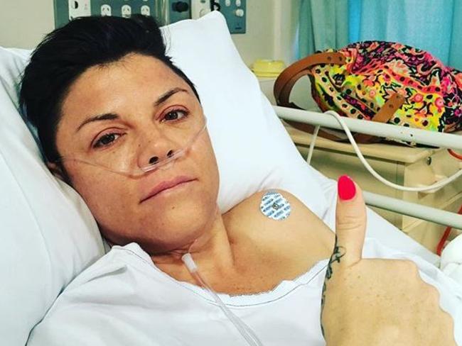 Comedian Em Rusciano after being rushed to hospital in Melbourne with a burst appendix.