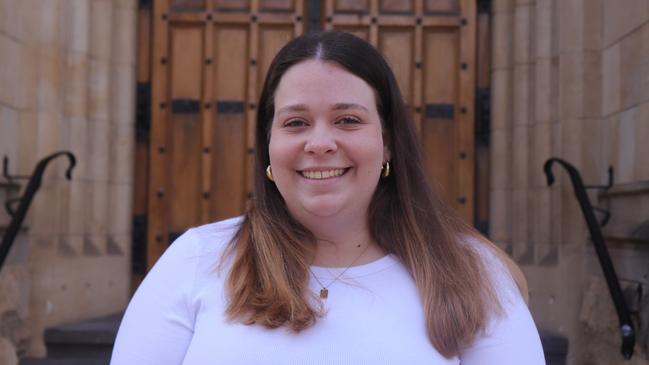 Georgia Thomas was president of the University of Adelaide’s student representative council in 2023, pictured here standing in front of Bonython Hall. Picture: Supplied