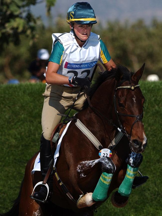 Olivia Bunn rides Top of the Line through the water jump in the cross country discipline of the Equestrian at the 2004 Olympic Games. (AAP Image/Julian Smith)