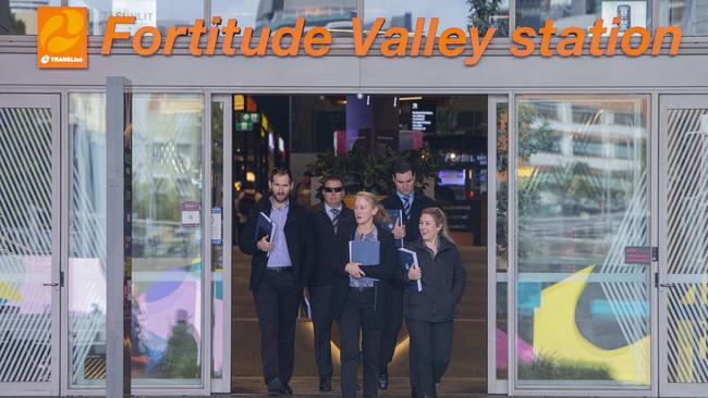 Detectives at the Fortitude Valley station after a fatal stabbing.