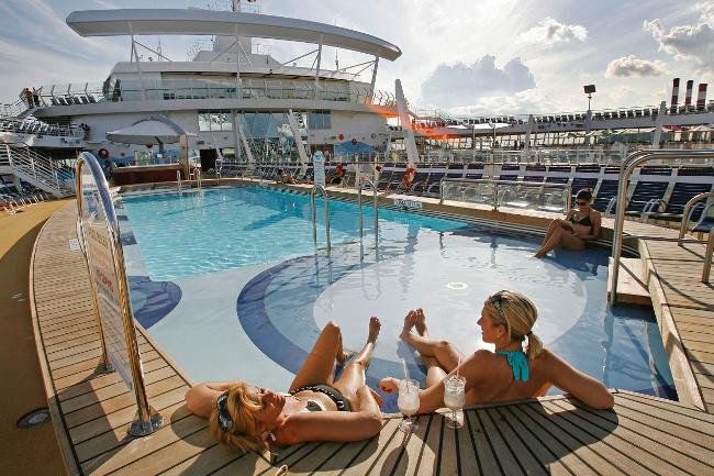 <p>Women relax in one of the pools onboard the Oasis of the Seas / AP</p> <br/>