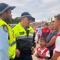 Police speak to the Dragons fan (right). Picture: Facebook