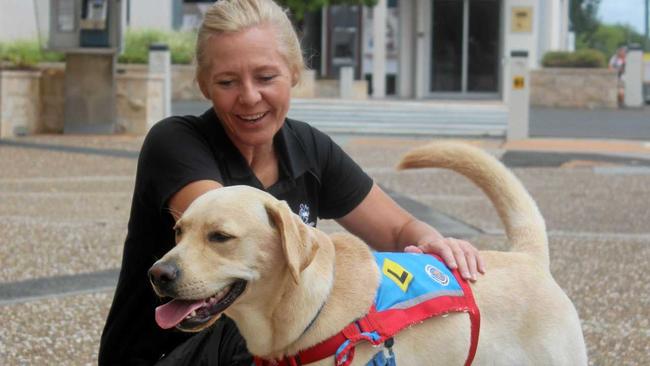 Southern Queensland Correctional Centre's Jane with Assistance Dogs Australia's Pups in Prison Program pooch Hoover during an outing in Gatton. Picture: Donna Marchiori