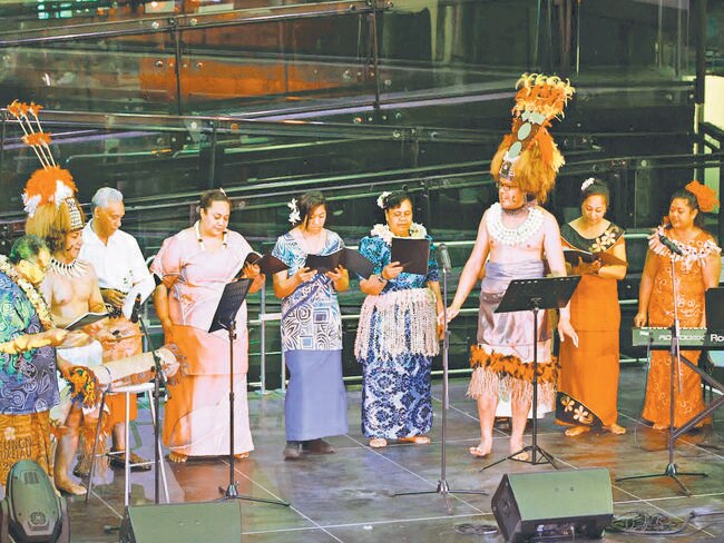 The choir in traditional Pacific Island outfits.