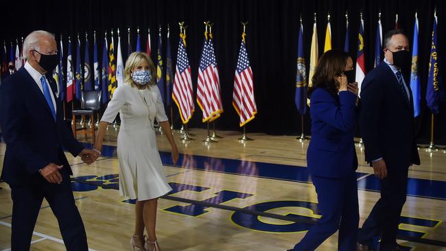 Joe Biden and his wife Jill (L) follow vice presidential running mate Kamala Harris and her husband Douglas Emhoff (R) after their first press conference. Picture: Olivier Douliery/AFP