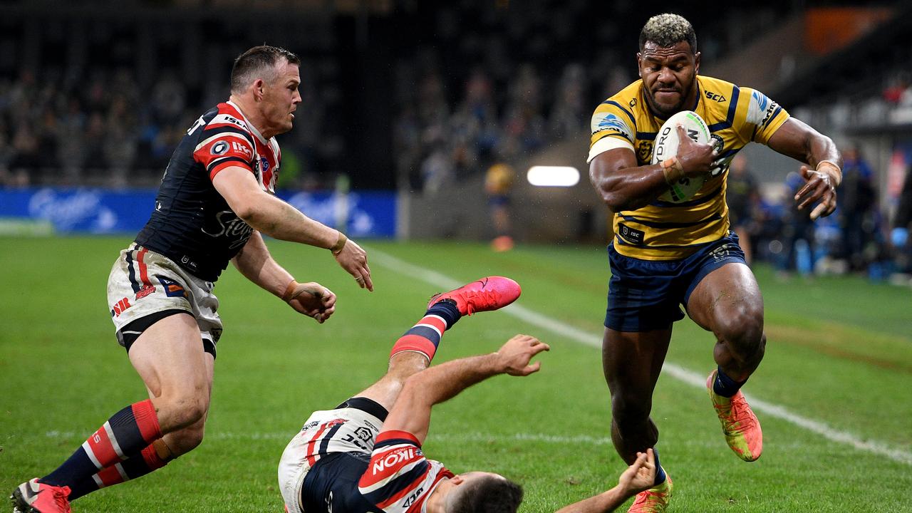 Parramatta’s Maika Sivo demolished James Tedesco (bottom) before scoring a brilliant try on Saturday night.