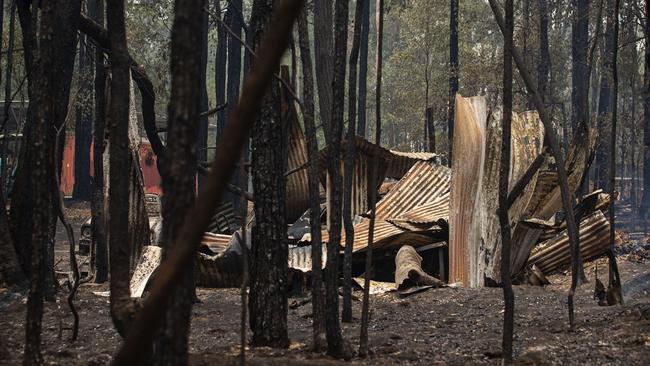 A bushfire damaged proprty in Orangeville. Picture: Adam Yip