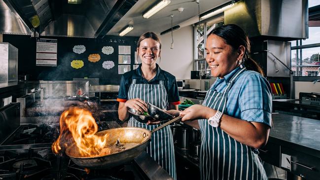 Port Lincoln High School students Simeona and Tarli getting real experience in the kitchen. Picture: Robert Lang