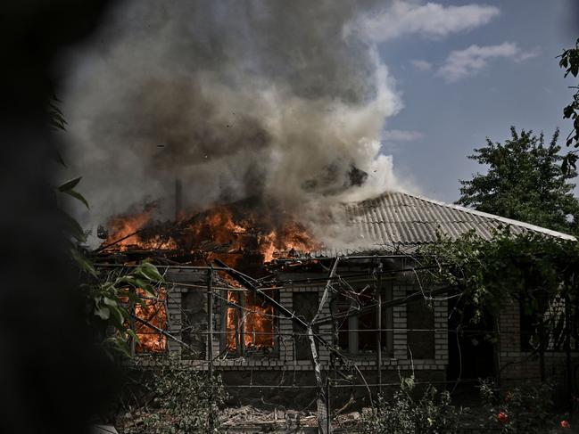 A house burns after being shelled during an artillery duel between Ukrainian and Russian troops in the city of Lysychansk. Picture: AFP