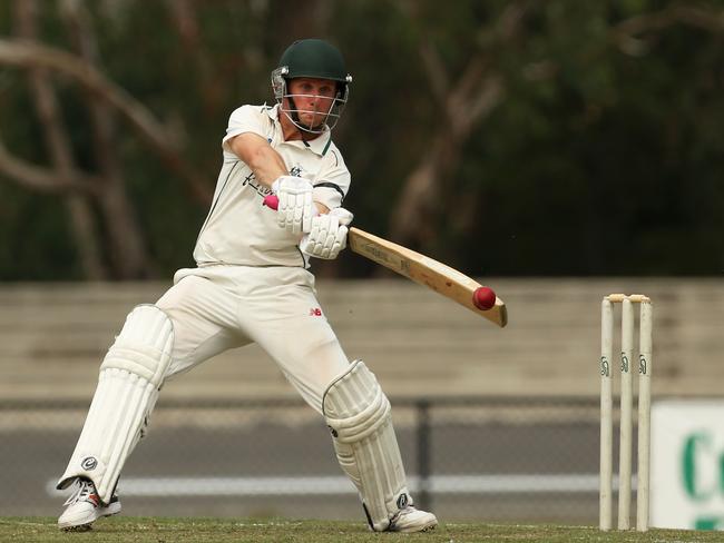 Ben Osborne cuts in the final against Noble Park. Picture: Stuart Milligan