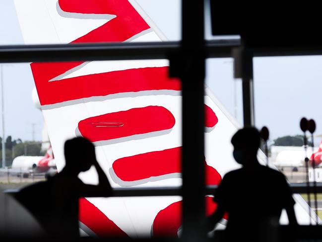 SYDNEY, AUSTRALIA - NewsWire Photos JANUARY 11, 2022: Inside Virgin domestic departures at Sydney Doimestic Airport. Virgin Australia has cut a quarter of all flights from its schedule in January and February, with hundreds of scheduled flights not resuming until the end of June, as the country's Covid crisis plunges thousands of workers into isolation. Picture: NCA NewsWire / Dylan Robinson