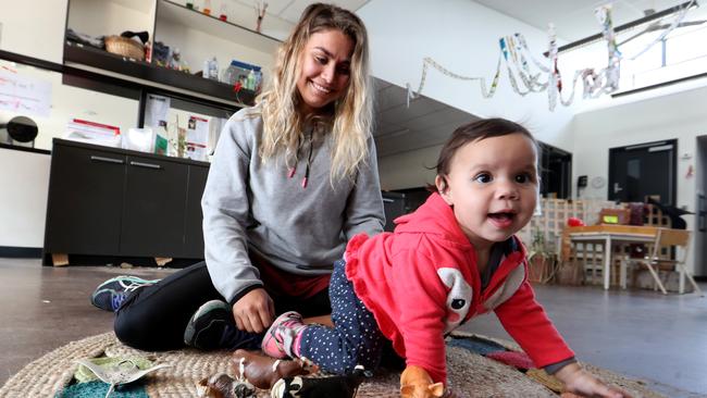 Early years educator Elvie Kelly-Britten with 11-month-old Jasmine Norman at a Melbourne early learning centre. Indigenous children will receive 36 hours of subsidised childcare a fortnight under the Albanese government’s planned overhaul. Picture: David Geraghty/The Australian