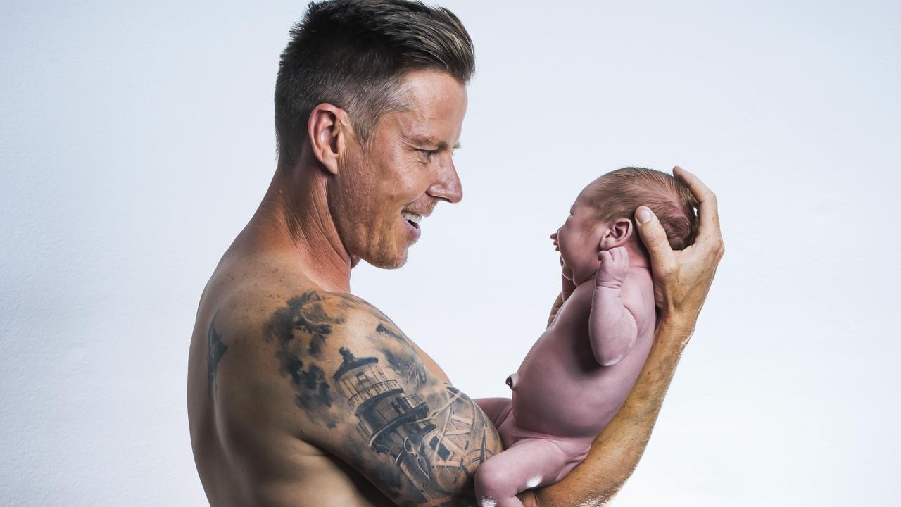 James Courtney with their new son Kobe. Picture: Nigel Hallett