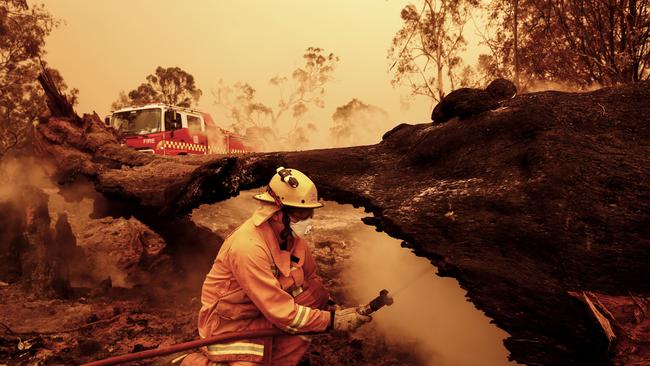 Fire crews put out spot fires on January 04, 2020 in Gippsland, Victoria. Picture: Darrian Traynor/Getty Images