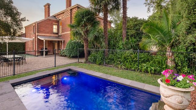There’s a heated in-ground pool with swim jets and a half-basketball court in the garden.