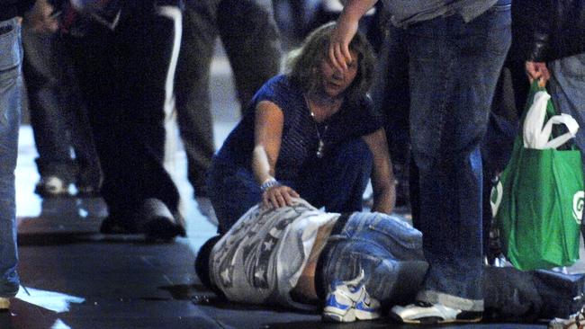 Alcohol on the streets. Binge city. Public drinking. Person unconscious on the footpath after being king hit outside Young and Jacksons, cnr Flinders and Swanston. 1.45am Sunday 27/05/2007. Violence.