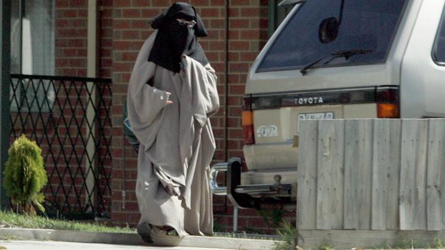 Rakia, wife of Abdul Nacer Benbrika, outside their home.