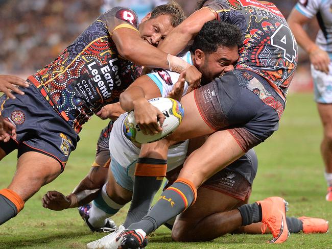 BRISBANE, AUSTRALIA - FEBRUARY 13: Konrad Hurrell of the World All Stars fights through the defence to score a try during the NRL match between the Indigenous All-Stars and the World All-Stars at Suncorp Stadium on February 13, 2016 in Brisbane, Australia. (Photo by Bradley Kanaris/Getty Images)