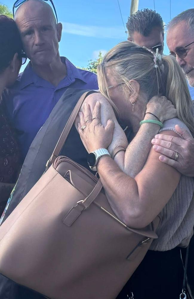 Distraught loved ones of nurse Sheree Robertson, including sister Lisa Latimer (pictured in pale shirt and blonde ponytail) outside court following the sentencing of the teen who caused the deaths of three women.