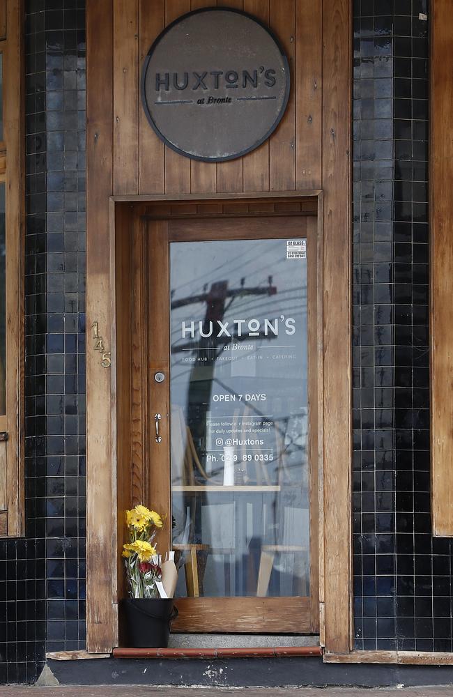 Flowers at the door of celebrity chef Justin Bull’s cafe Huxton's cafe in Bronte on Friday. Picture: Ryan Pierse/Getty Images