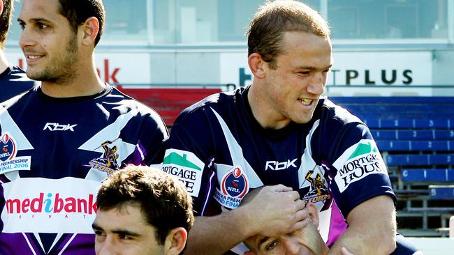 Melbourne Storm team photo at Princes Park this morning. Jamie Feeney puts Matt Geyer in a head lock.