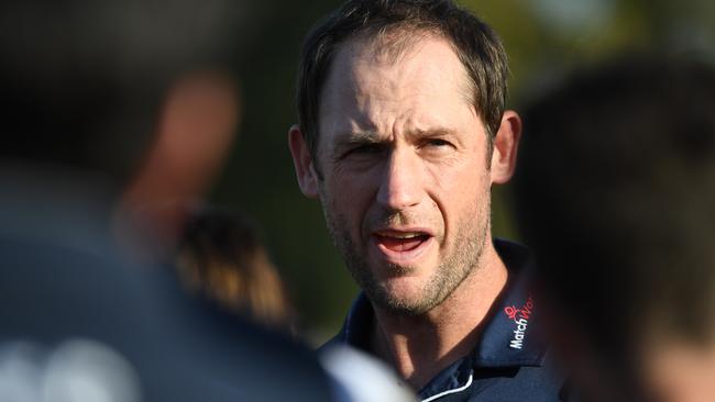 Northern Blues coach Josh Fraser talks to his player.