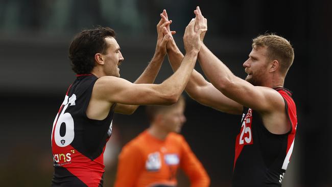 John Jorgensen (left) has joined the Wangaratta Rovers next year after playing for Essendon in the VFL this year. He celebrates a goal teammate Jake Stringer in the photo. Photo by Daniel Pockett/AFL Photos/via Getty Images