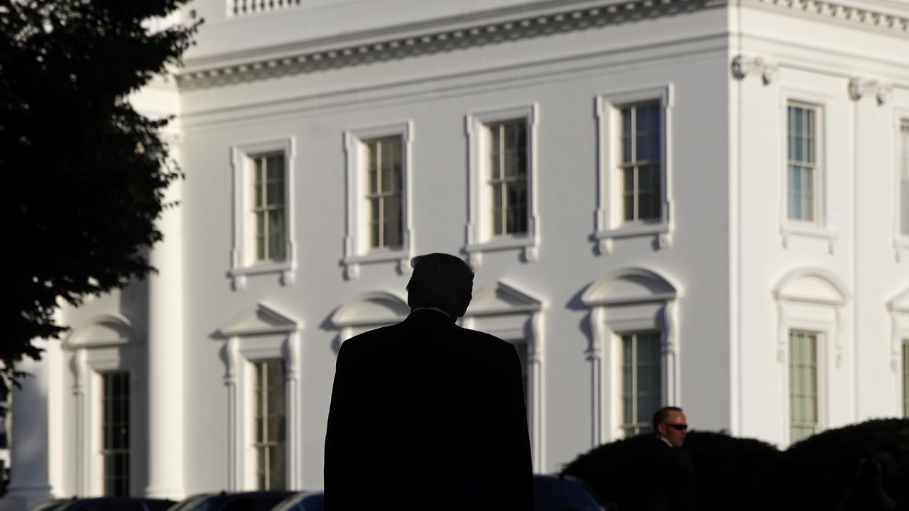 Donald returning to the White House after his brief walk outside. Picture: Patrick Semansky/AP