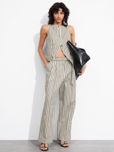 & Other Stories Tailored Strappy Waistcoat and & Other Stories Striped Tailored Trousers. Picture: THE ICONIC.