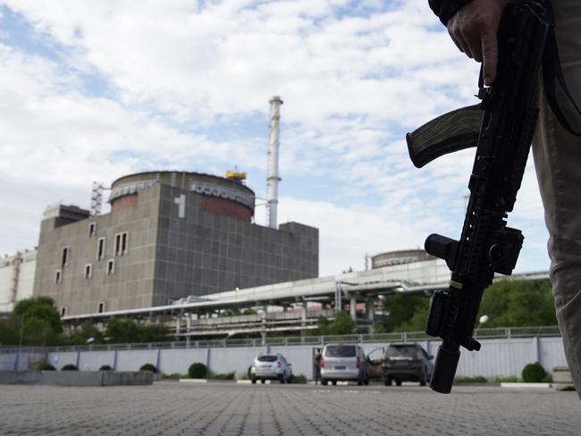 A security person standing in front of the Zaporizhzhia Nuclear Power Plant in Enerhodar amid the ongoing Russian military action in Ukraine. Picture: AFP