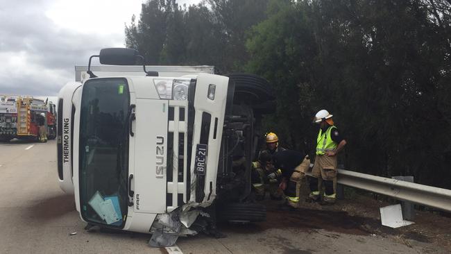 A truck was left on its side after a crash on the M1 on Monday. Photo: Alison Marks