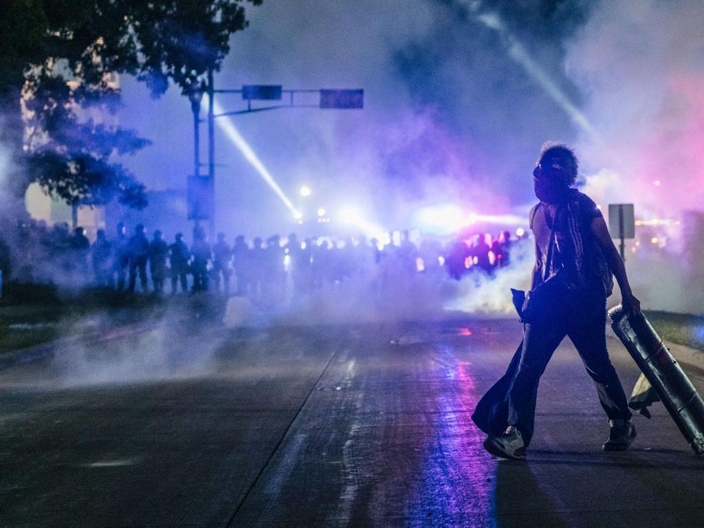 A demonstrator carries a makeshift shield in Kenosha, Wisconsin. Picture: Brandon Bell/Getty Images/AFP