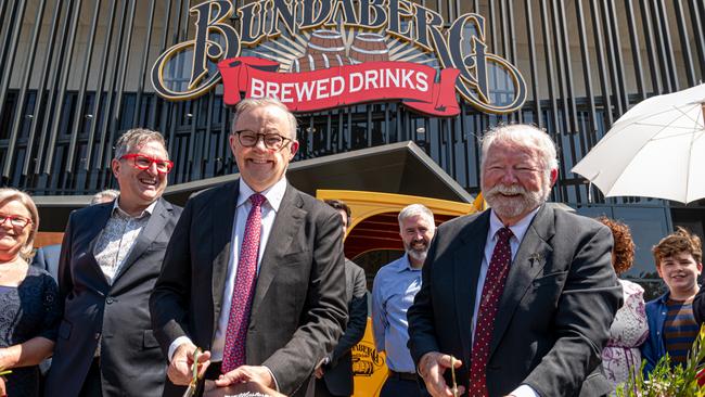 Anthony Albanese cuts the ribbon to open the new super brewery along with Bundaberg Brewed Drinks founder Cliff Fleming.