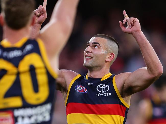 ADELAIDE, AUSTRALIA - AUG 11: Josh Rachele of the Crows celebrates a goal during the 2024 AFL Round 22 match between the Adelaide Crows and the Western Bulldogs at Adelaide Oval on August 11, 2024 in Adelaide, Australia. (Photo by Sarah Reed/AFL Photos via Getty Images)