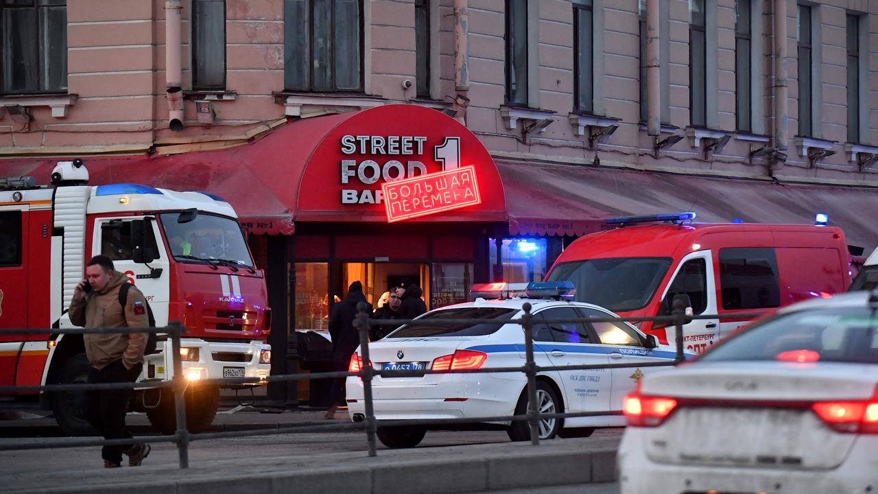 Russian police investigators inspect the damaged cafe after the blast. Picture: Olga Maltseva/AFP