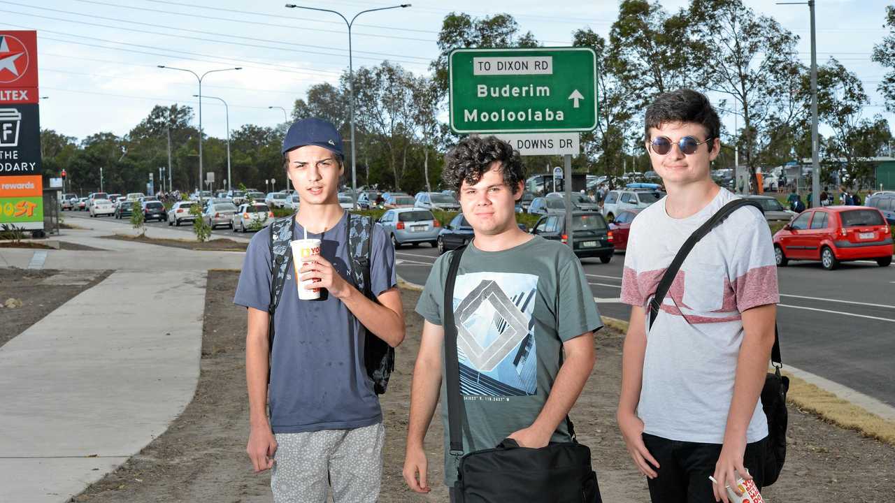 Tyson Alker, 18, left, Luke Kellett, 18, and Connor Delaney 18, are University of the Sunshine Coast students taking advantage of the nearby food options which have drawn hundreds of schoolkids each day. Picture: Craig Warhurst