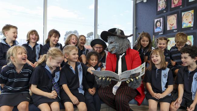 St Raphael's school principal Emma Fowler dons a ‘big bad wolf’ costume to read to young students. Picture: Brett Hartwig