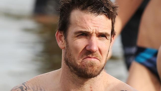 MELBOURNE, AUSTRALIA - JULY 14: Dane Swan of the Magpies reacts as he walks out of the water during a Collingwood Magpies AFL recovery session at St Kilda Beach on July 14, 2014 in Melbourne, Australia. (Photo by Michael Dodge/Getty Images)