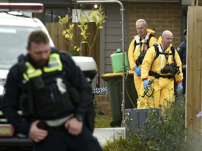 Emergency services wore hazard suits. Picture: Andrew Henshaw