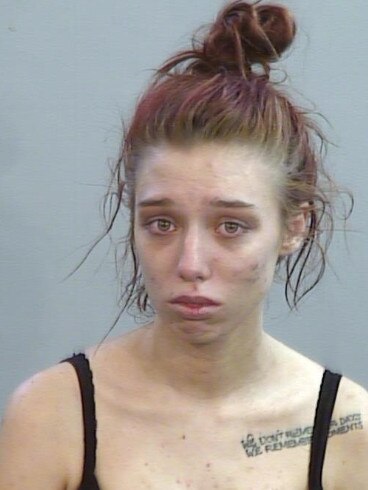 Tiffany-Anne Brislane-Brown, jailed for bushfire fraud, in her mugshot with Newcastle Police. Credit: NSW Police