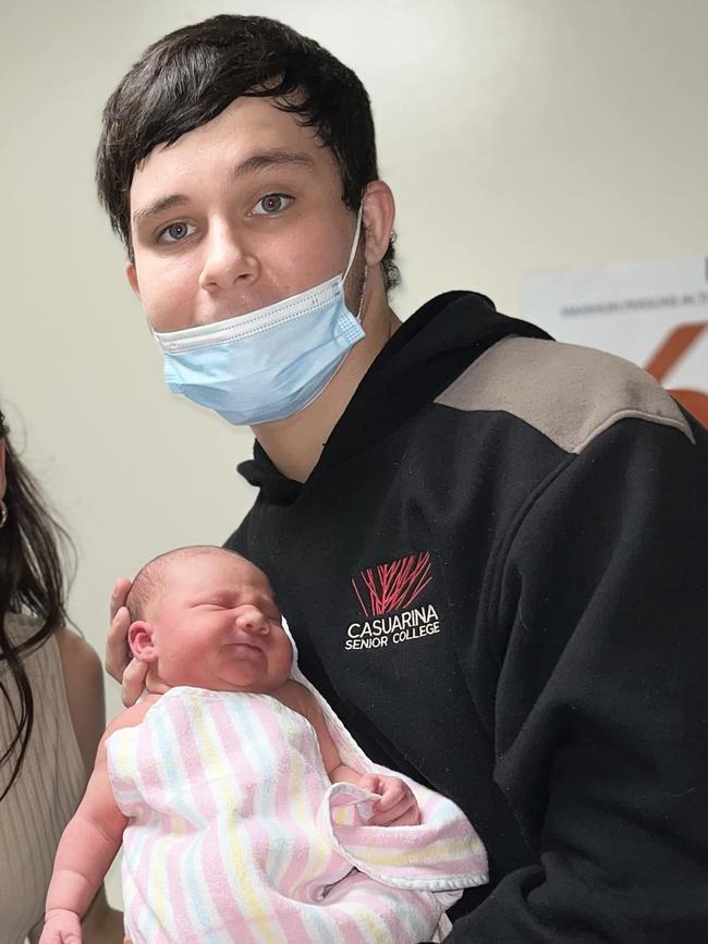 Kingsley 'Junior' Alley holding his daughter Eleanor. The 18-year-old was allegedly murdered in Palmerston on October 8.