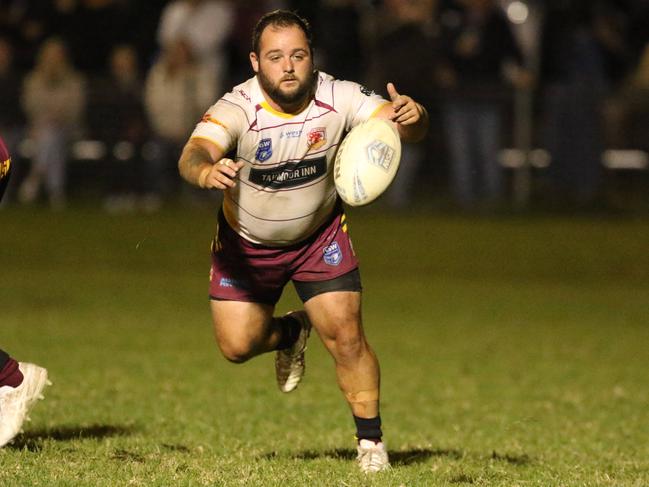 Adam Campbell fires out a pass for Thirlmere. Photo: Warren Gannon Photography