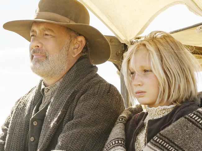 Tom Hanks, left, and Helena Zengel appear in a scene from "News of the World." (Bruce W. Talamon/Universal Pictures via AP)