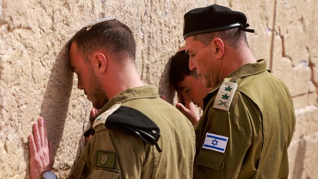 Lieutenant General Eyal Zamir (R) prays on the Western Wall in the old city of Jerusalem. Picture: AFP