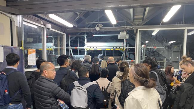 People lining up to get on alternate trains at St Peters. Picture: Robbie Patterson