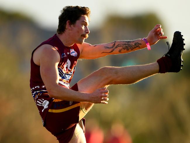 Joshua Stone of Tarneit kicks during the round eleven 2023 Rookie Me Division 3 Seniors match between Tarneit and West Footscray at Wootten Road Reserve in Tarneit, Victoria on July 1, 2023. (Photo by Josh Chadwick)