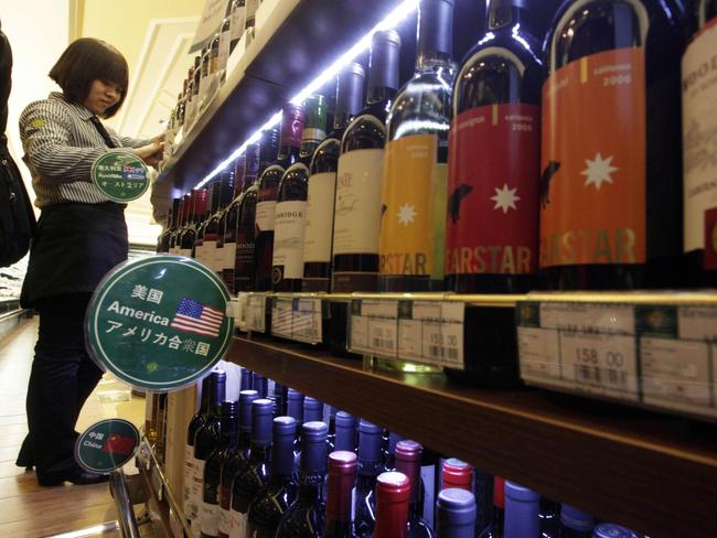 As the world’s two biggest economic powers slap retaliatory tariffs on each other’s products, Australian exports including fruit, wine and nuts could receive a boost. Picture: AP Photo/Ng Han Guan