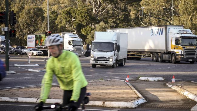 Traffic flows around the Glen Osmond intersection after a B-double tipped earlier this month, with traffic cones where the traffic lights used to stand. Picture: AAP/Mike Burton